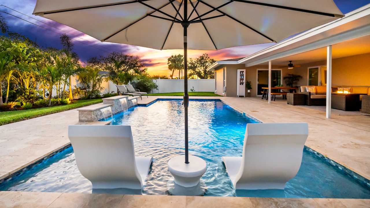 swimming pool with lounge chairs