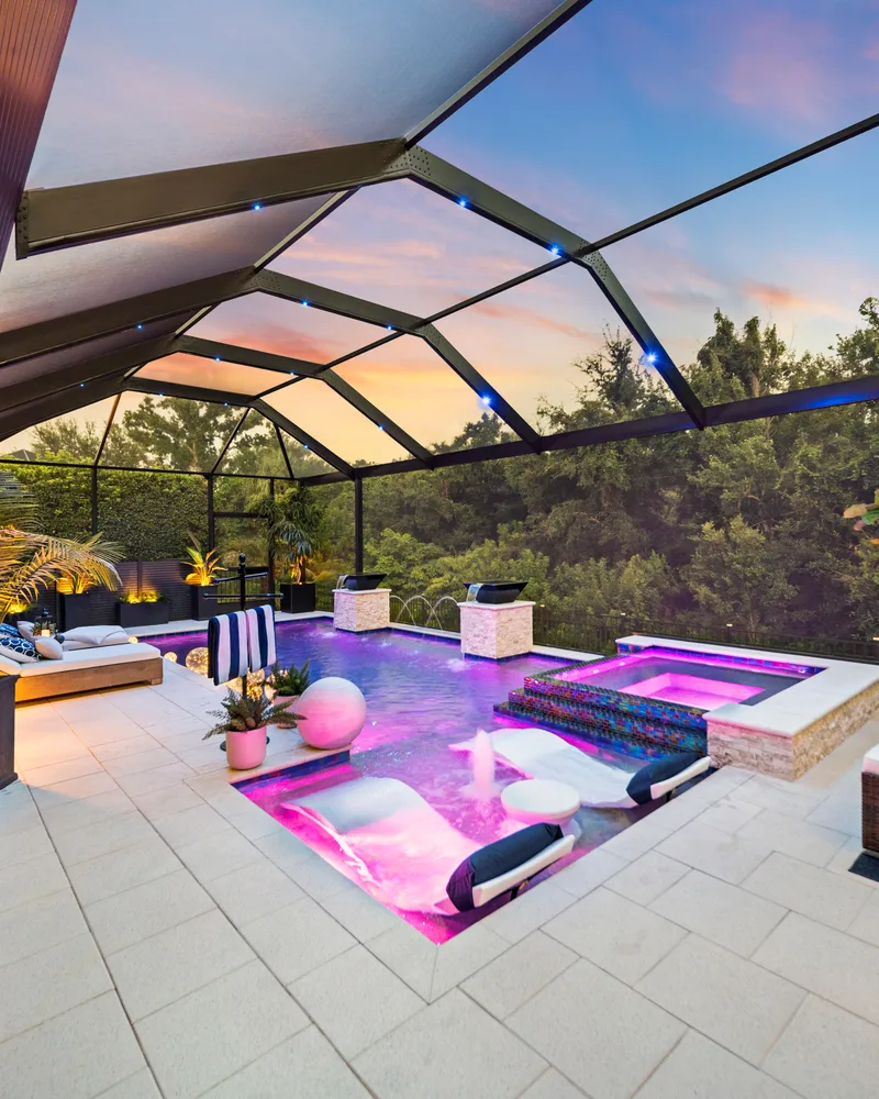Custom pool with stone pillars, water bowls and deck jets built by Pool Perfection in Tampa